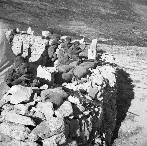 The British Army, strengthened by newly arrived reinforcements from England, Malta, India, and Egypt are conducting an intensive drive against Arab Rebels in historic Galilee, Northern, Palestine. British riflemen in action against Arab rebels at a mountain outpost in Israel on Nov. 10, 1938. 
