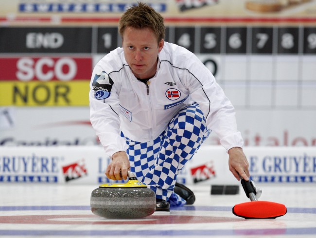 Norway's skip Torger Nergard releases a stone on his way to win a semifinal match against Scotland, at the Curling World Championships, in Cortina D'Ampezzo, Italy, Saturday, April 10, 2010. (AP Photo/Antonio Calanni)