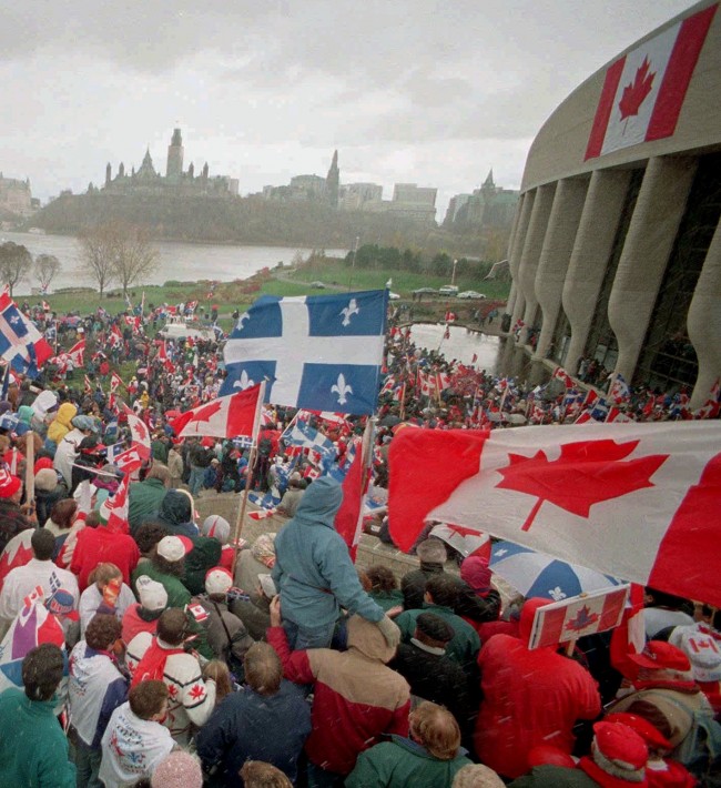 Thousands of supporters for national unity gather at the Museum of Civilization in Hull, Quebec, across the Ottawa river from Parliament Hill, Sunday October 29, 1995. The two sides in Quebec's bloodless but bitter war of secession made emotional final appeals Sunday to the undeclared voters who will cast the crucial ballots in the vote on splitting from Canada.(AP PHOTO/Fred Chartrand)