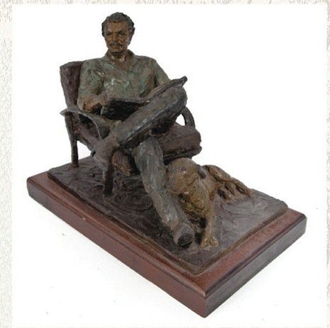 Sculpture of Reynolds reading a newspaper, opening bid $1000-2000