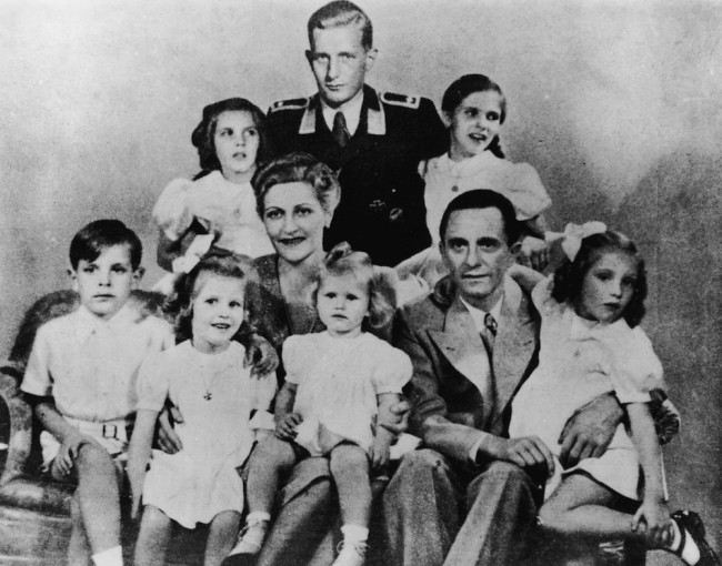German Nazi politician and minister of propaganda Paul Joseph Goebbels (1897 - 1945) with his wife Magda and their children, Helga, Hildegard, Helmut, Hedwig, Holdine and Heidrun, 1942. Also present is Harald Quandt (in uniform), Magda Goebbels' son by her first marriage. With the fall of the Third Reich, Magda and Josef Goebbels poisoned their six children before themselves committing suicide. (Photo by Keystone/Hulton Archive/Getty Images)