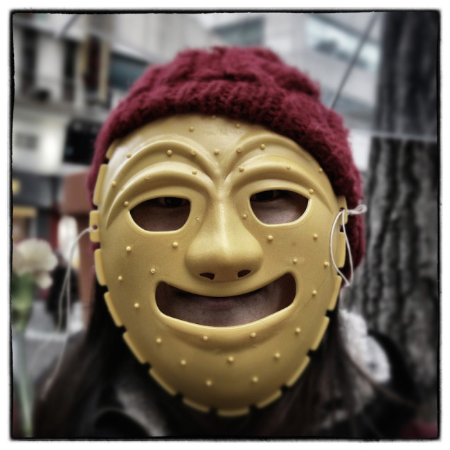 SEOUL, SOUTH KOREA - DECEMBER 05: (EDITORS NOTE: Image was altered with digital filters.) A protester wearing a mask during the anti-government rally on December 5, 2015 in Seoul, South Korea. Demonstrators gathered on the streets of Seoul to protest against the government's decision to adopt new history textbooks and reform the labor market. Liberal civic groups decided to proceed the protest in the central Seoul despite a prohibition order from the police. (Photo by Chung Sung-Jun/Getty Images)